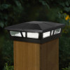 Angled shot of 6 x 6  Black Aluminum Solar Post Light with wooden post under it